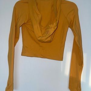 BODY BY RAVEN TRACY-ORANGE ATHLETIC ZIP UP FITTED- THUMB HOLES